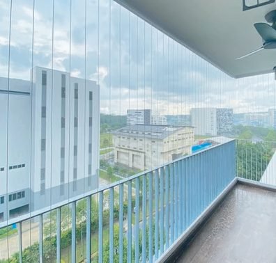 High-rise balcony with railing overlooking the city